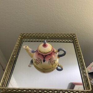 Small tea pot. Excellent condition. From base to tip of cover 5in. Diameter12in